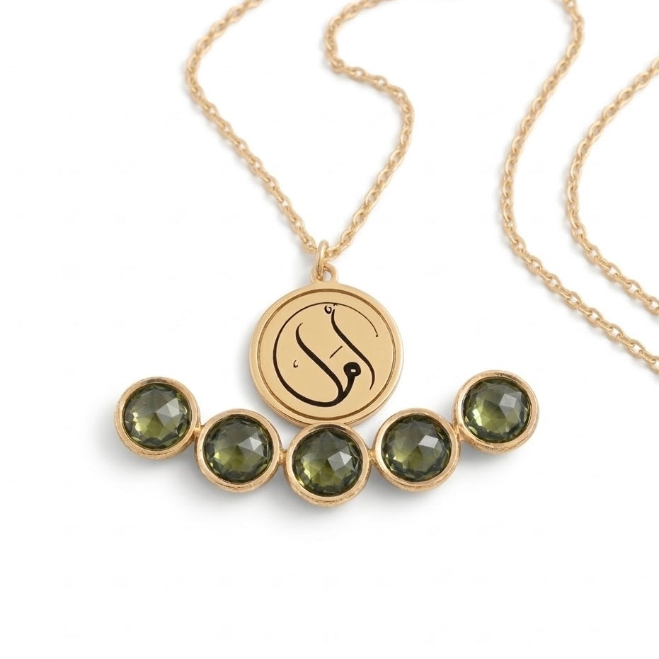 Close-up detail of the FABLED gold plated Amal calligraphy necklace 