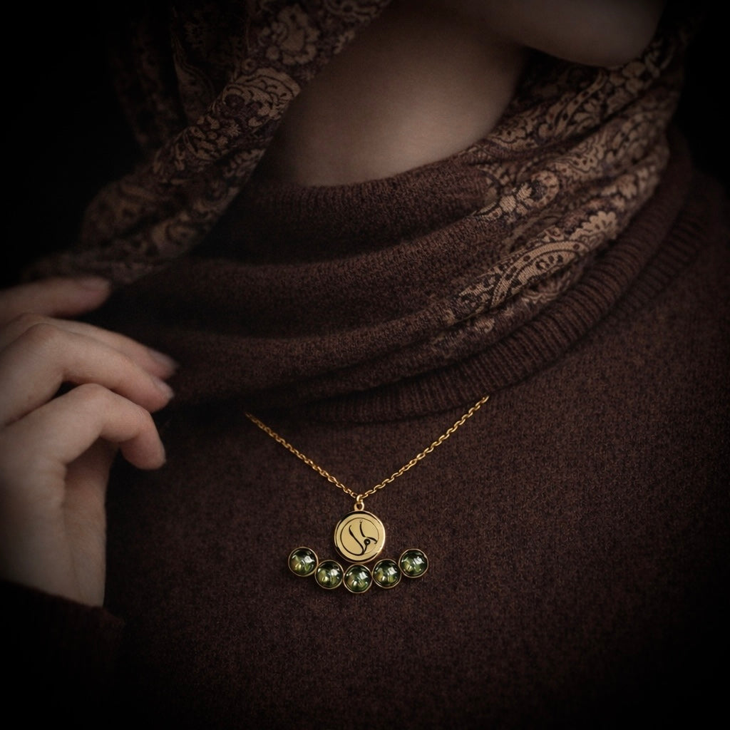 Gold plated Amal necklace featuring Arabic calligraphy by FABLED