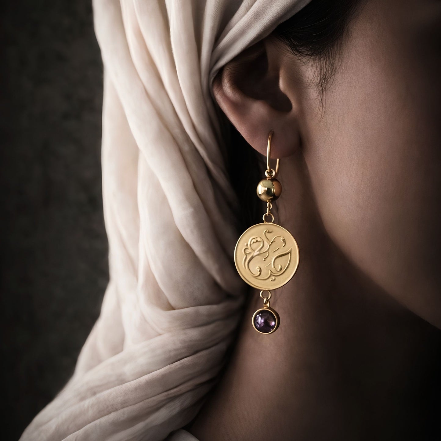 Gold plated haya earring featuring Arabic calligraphy by FABLED