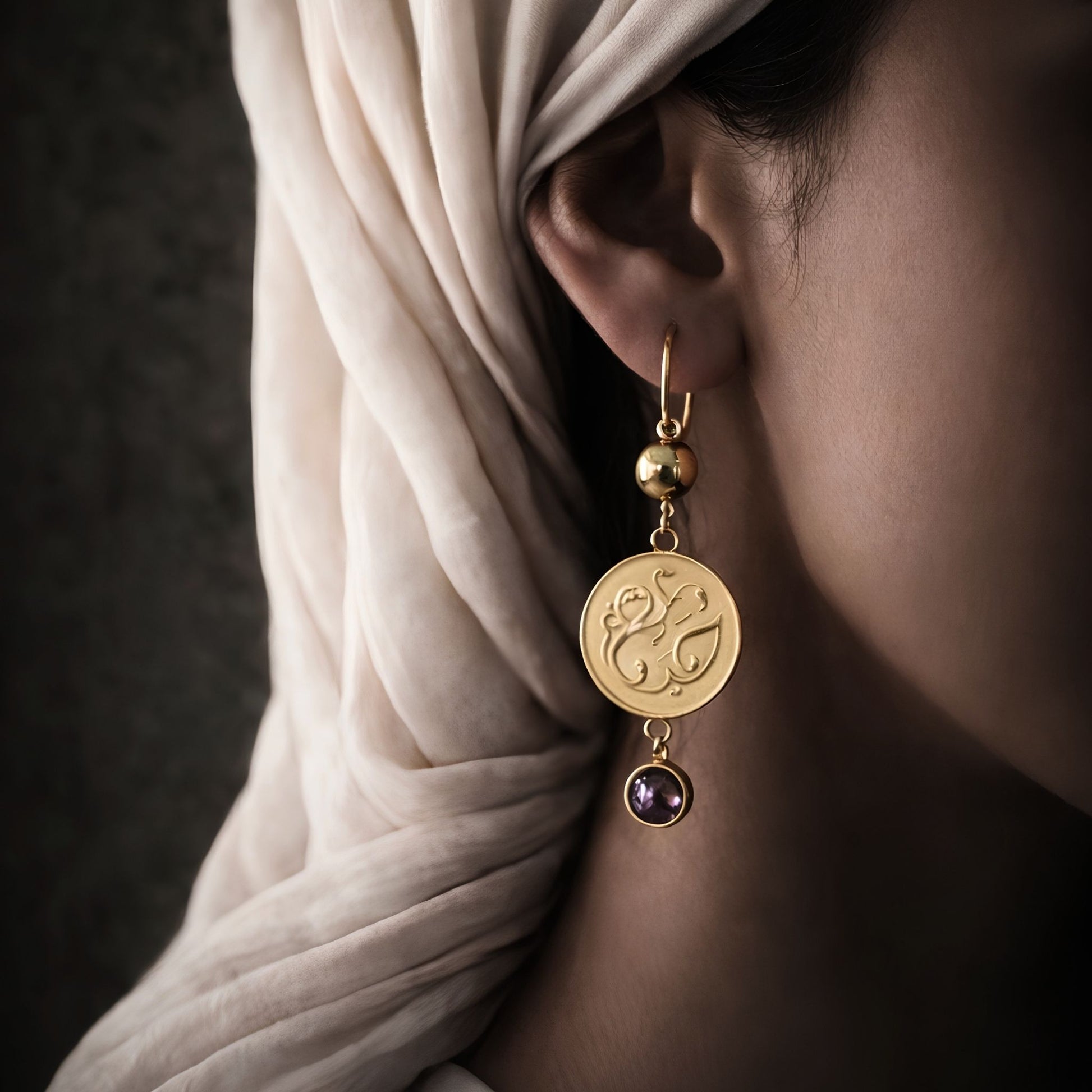 Gold plated haya earring featuring Arabic calligraphy by FABLED