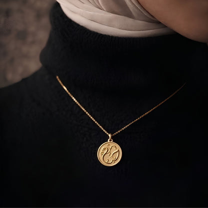 Gold plated haya coin necklace featuring Arabic calligraphy by FABLED