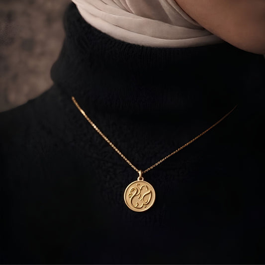 Gold plated haya coin necklace featuring Arabic calligraphy by FABLED