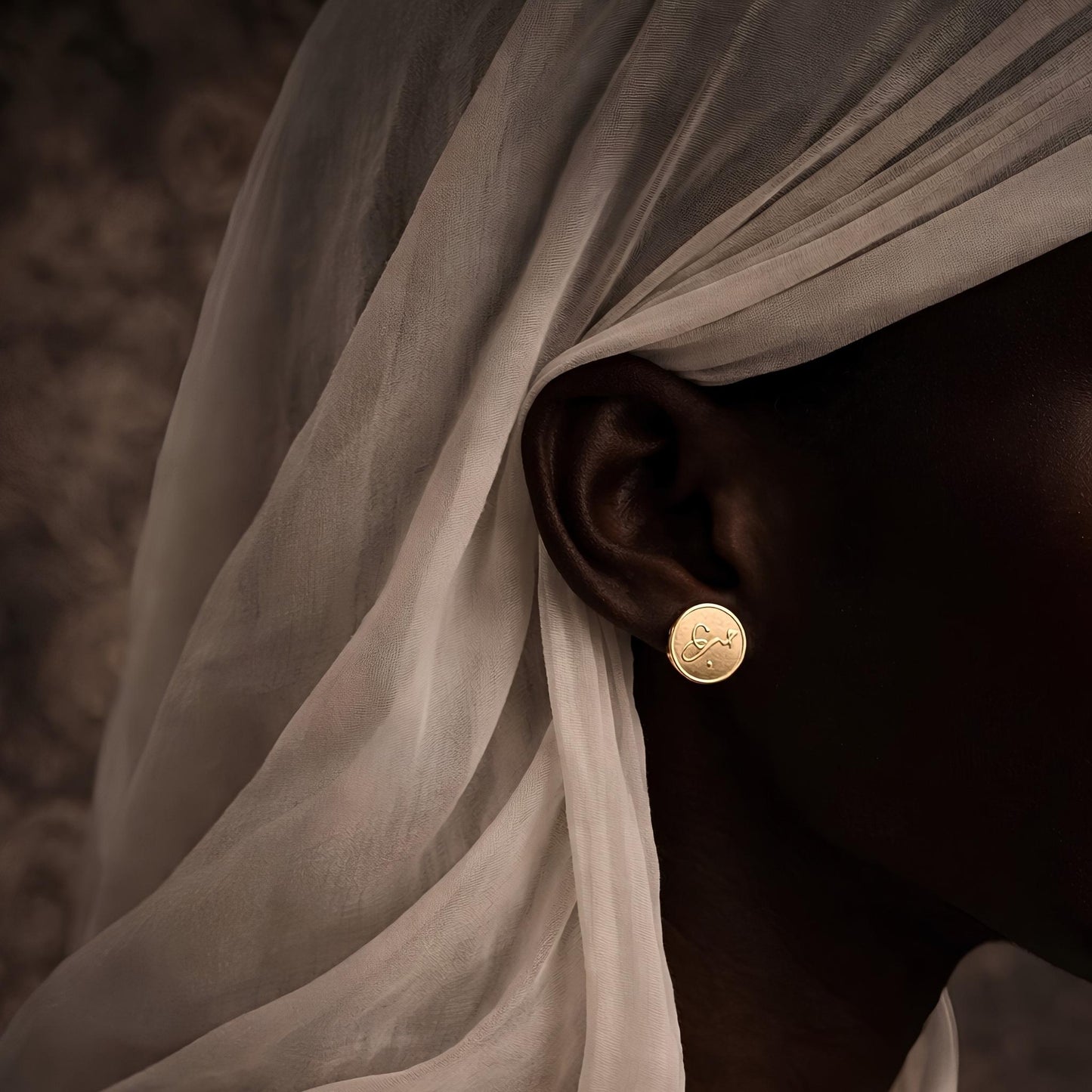 Gold plated hub coin earrings featuring Arabic calligraphy by FABLED