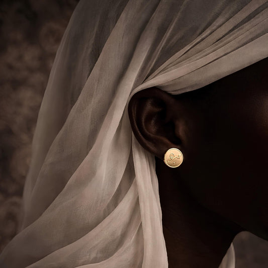 Gold plated hub coin earrings featuring Arabic calligraphy by FABLED