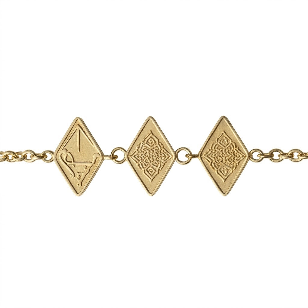 Close-up detail of the FABLED gold plated maktub calligraphy bracelet 