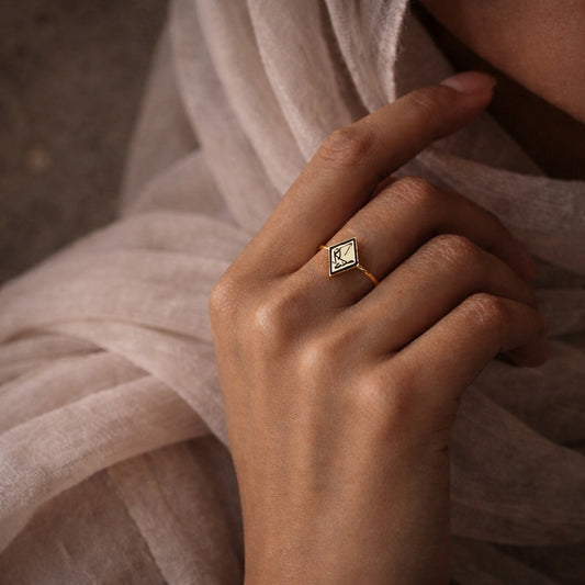 Gold plated Maktub ring featuring Arabic calligraphy by FABLED