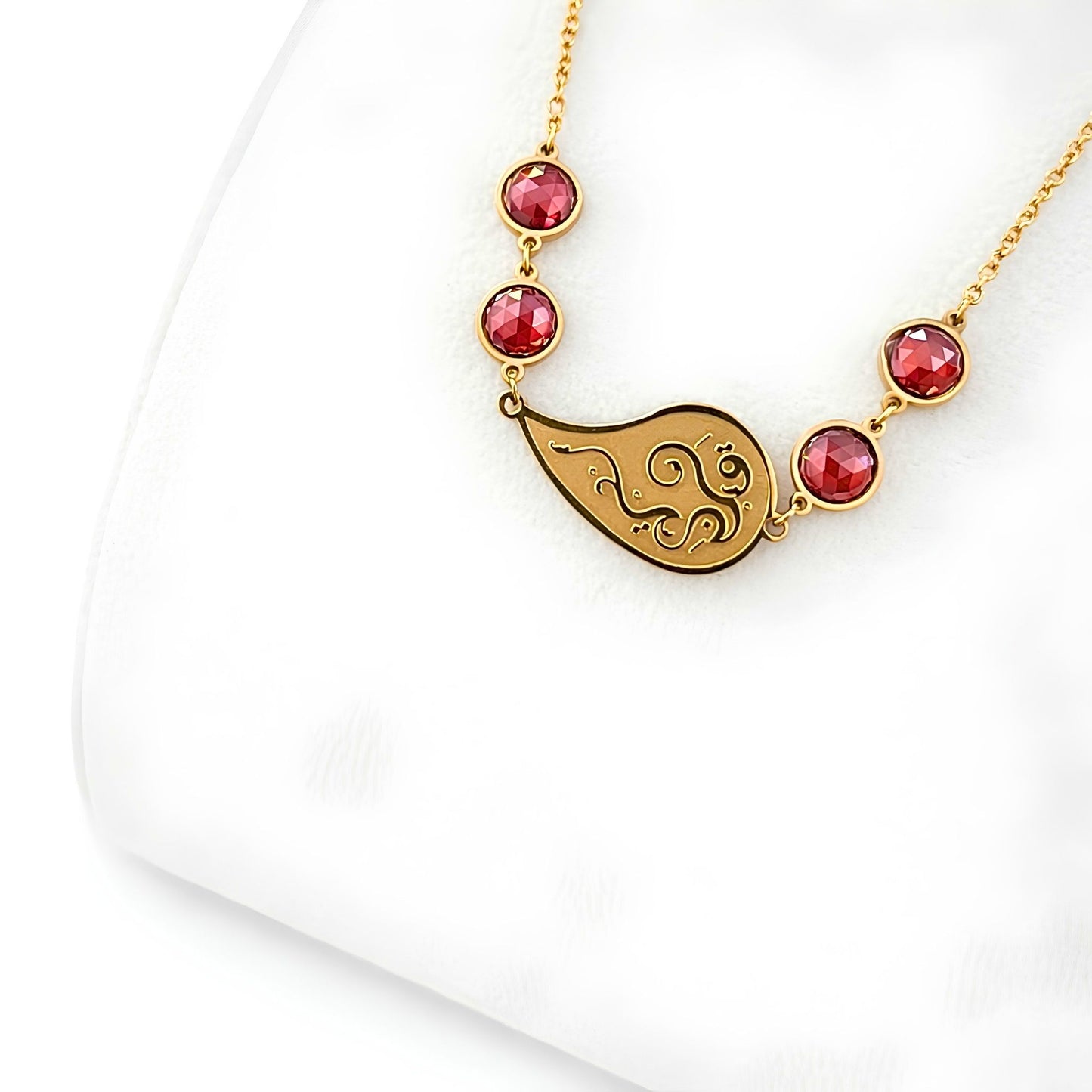Close-up detail of the FABLED gold plated Qalbi calligraphy necklace 