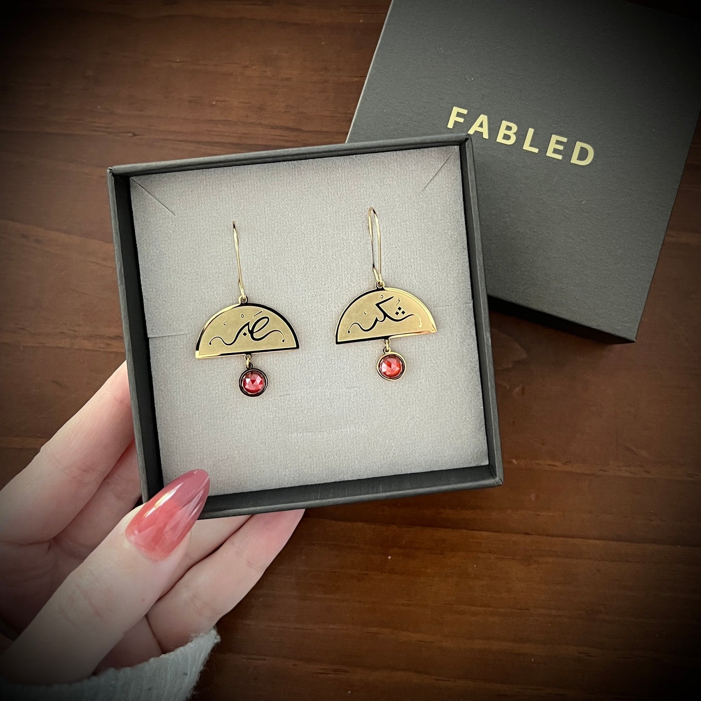 Gold Sabr and shukr earring featuring Arabic calligraphy by FABLED