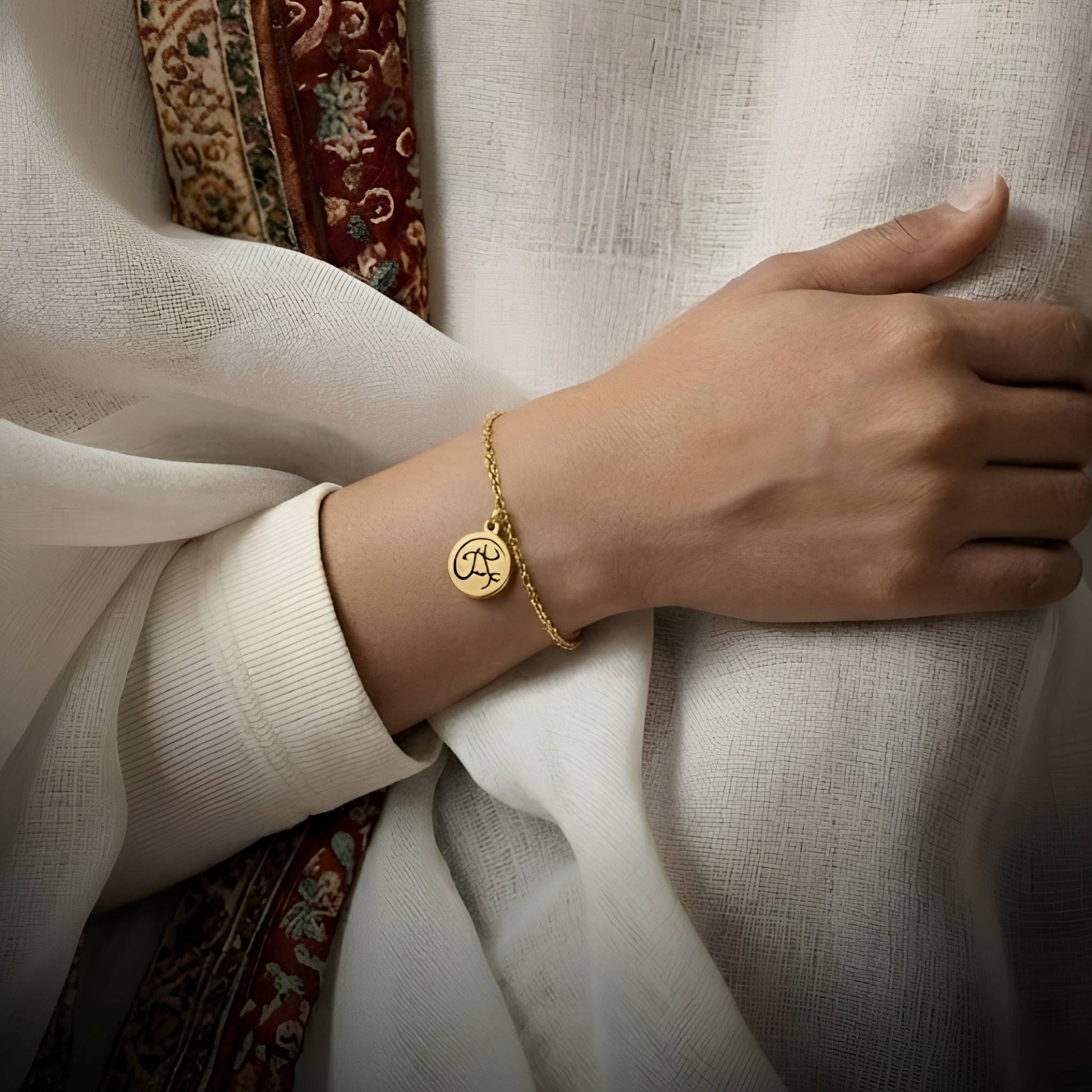 Gold tawakkul bracelet featuring Arabic calligraphy by FABLED