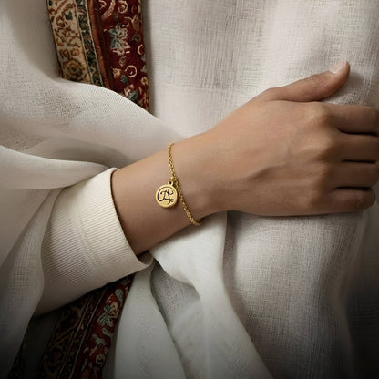 Gold tawakkul bracelet featuring Arabic calligraphy by FABLED