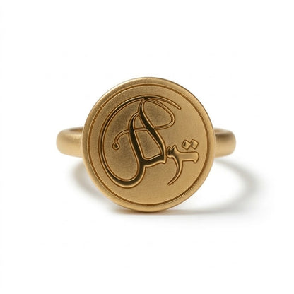 Close-up detail of the FABLED gold plated tawakkul coin calligraphy ring 
