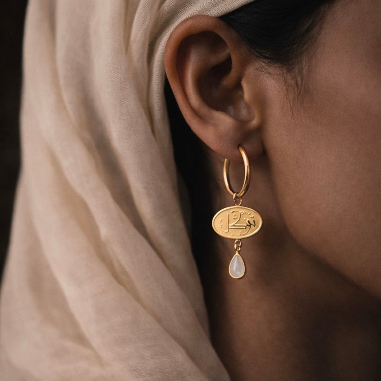 Gold tawakkul earring featuring Arabic calligraphy by FABLED