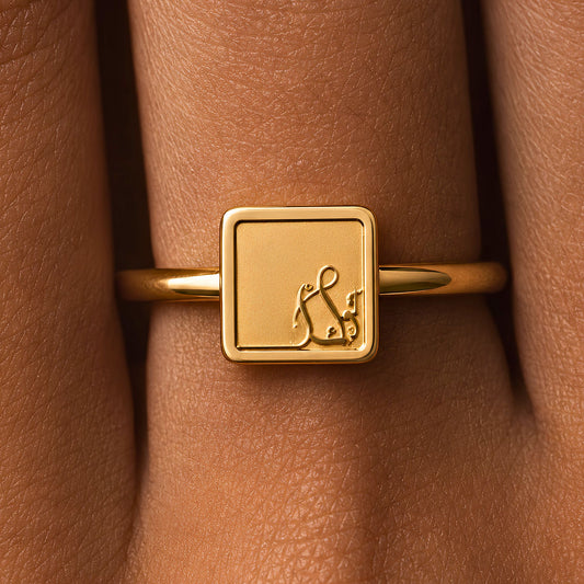 Gold plated tawakkul ring featuring Arabic calligraphy by FABLED.
