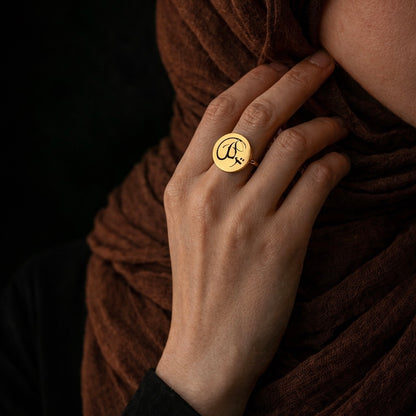 Gold coin tawakkul ring featuring Arabic calligraphy by FABLED