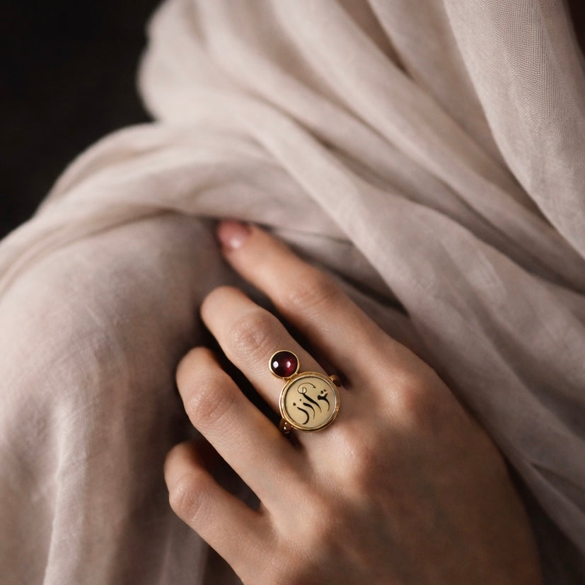 Gold tawazun ring featuring Arabic calligraphy by FABLED