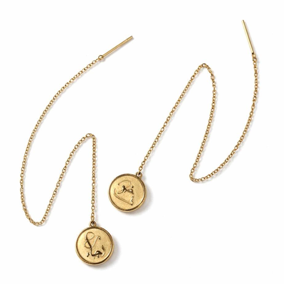 Close-up detail of the FABLED gold plated threader calligraphy earring 