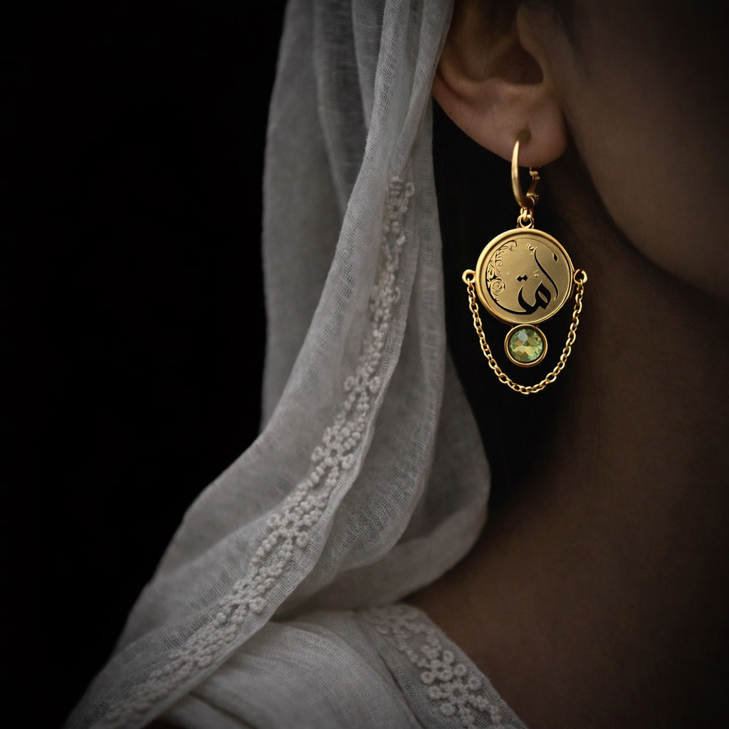 Gold plated ummah earring featuring Arabic calligraphy by FABLED