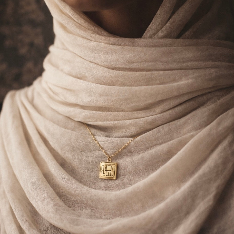 Gold plated wasatiyyah necklace featuring Arabic calligraphy by FABLED