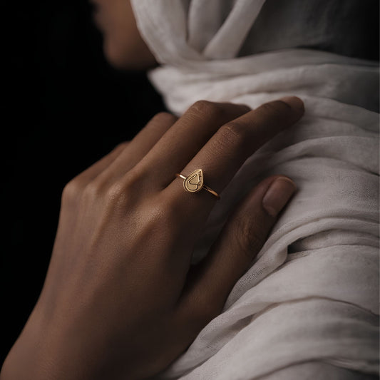 Gold hub ring featuring Arabic calligraphy by FABLED