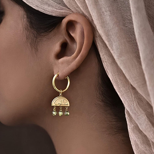 Gold maktub earring featuring Arabic calligraphy by FABLED