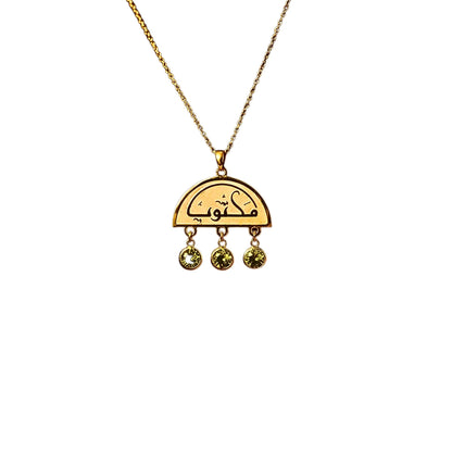 Close-up detail of the FABLED gold plated maktub calligraphy necklace 