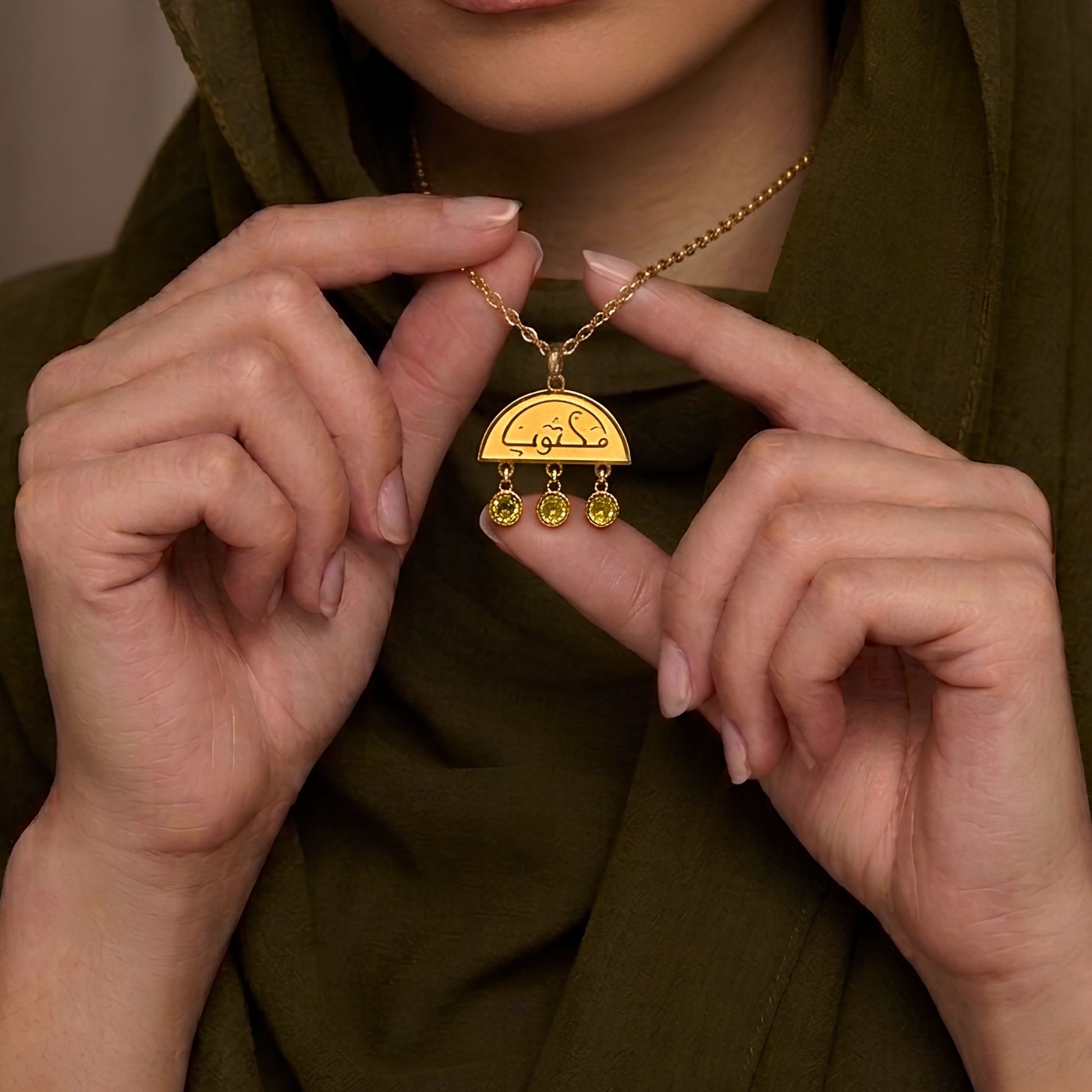 Gold maktub necklace featuring Arabic calligraphy by FABLED