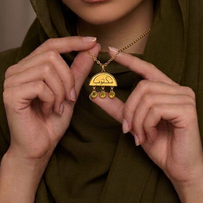 Gold maktub necklace featuring Arabic calligraphy by FABLED
