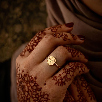 Gold Sabr ring featuring Arabic calligraphy by FABLED