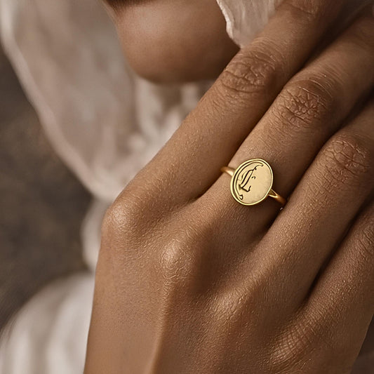 Gold salaam ring featuring Arabic calligraphy by FABLED