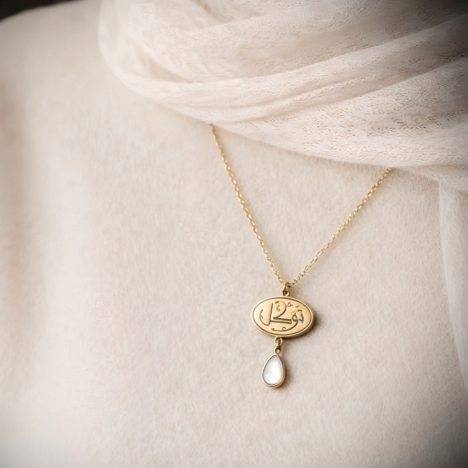 Gold plated tawakkul necklace featuring Arabic calligraphy by FABLED