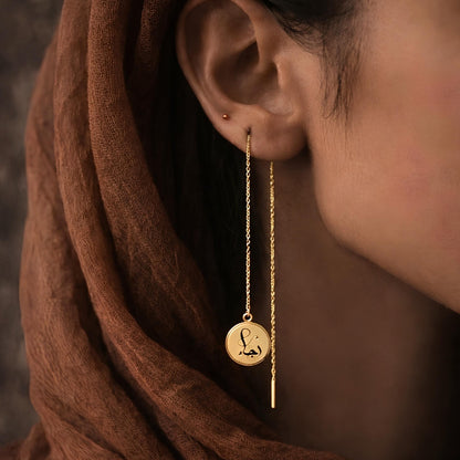 Gold threader earring featuring Arabic calligraphy by FABLED