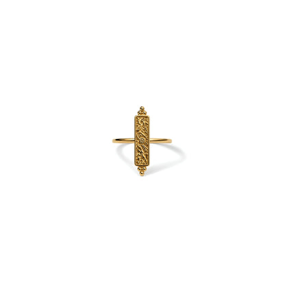 A gold plated ring with vintage floral motif in an antique finish, framed within a thin panel and crowned by stacked bead bookends, centered on a clean white background.